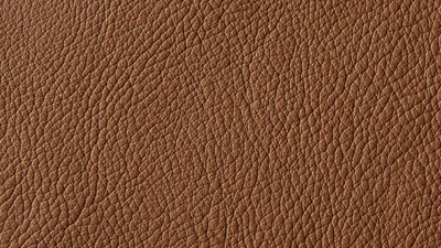 Närbild av tygprov i Narv-läder i nyansen cognac