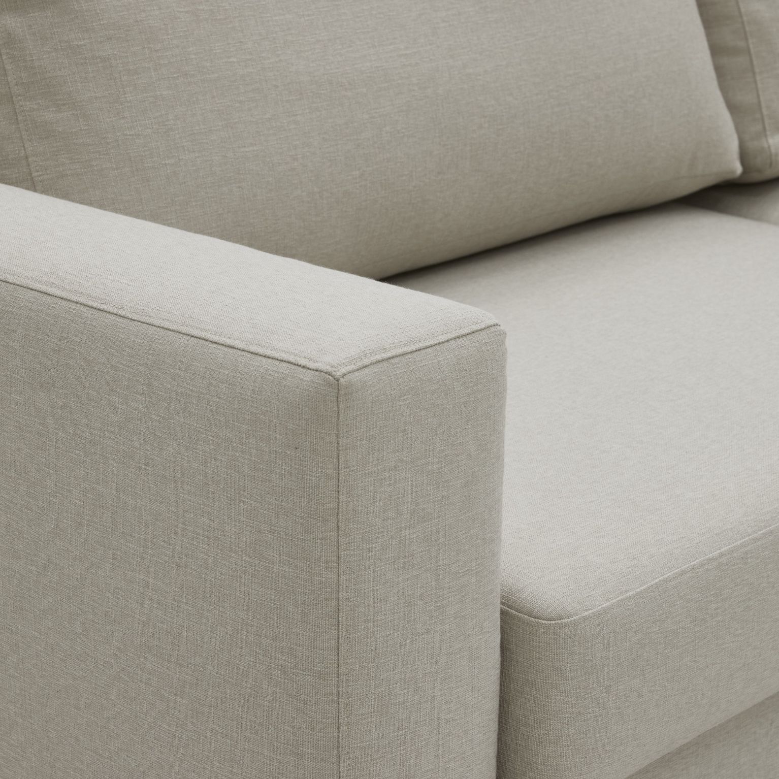 Närbild av armstöd i vitt.