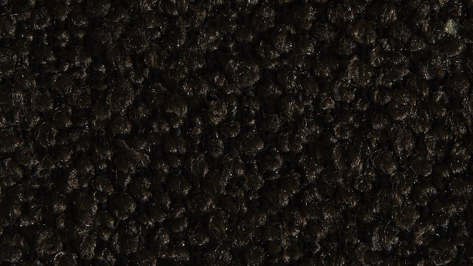 Närbild på Crush-tygprov i nyansen choco