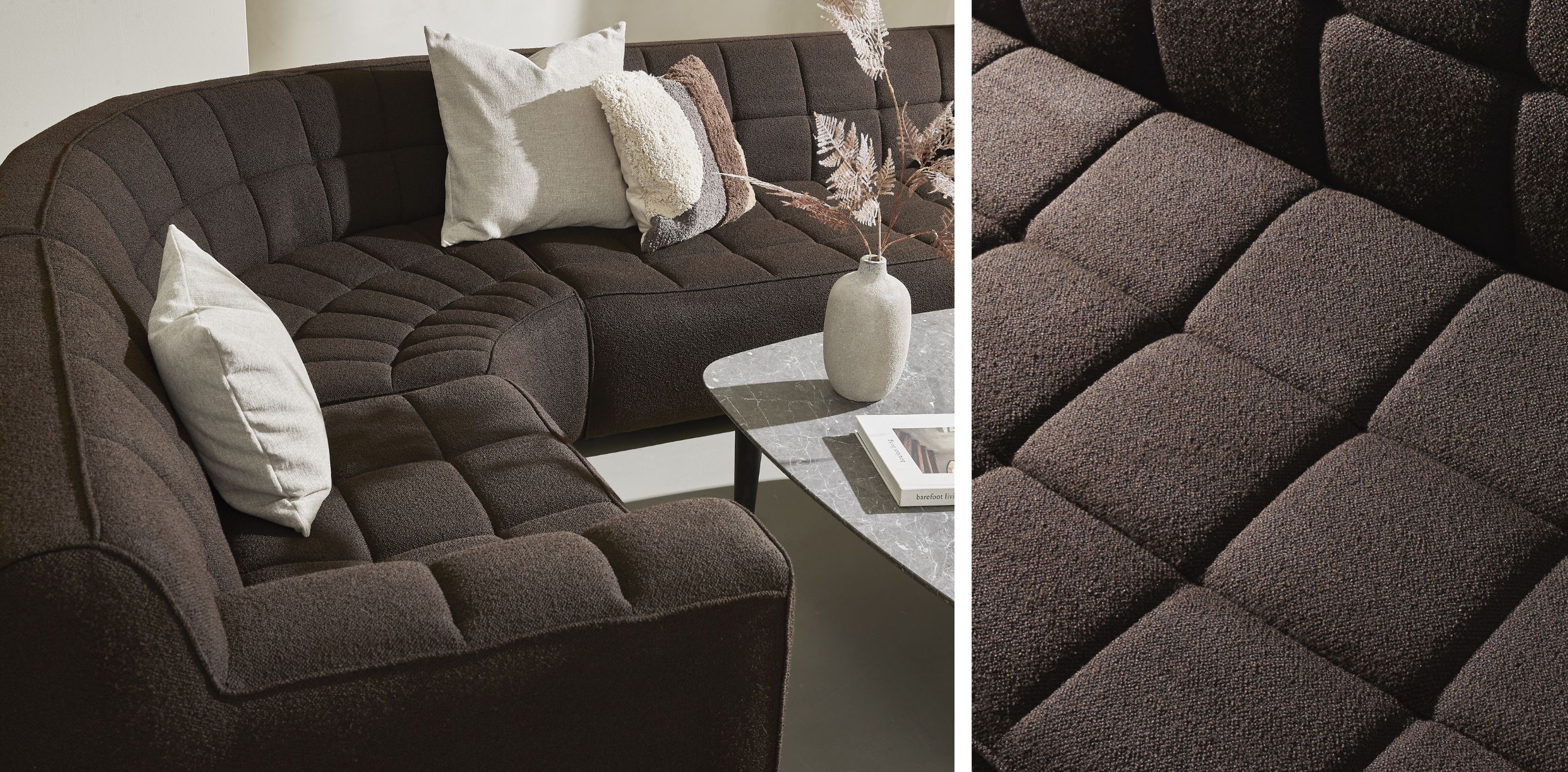 Brun rundad soffa med rutor.