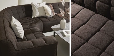 Brun rundad soffa med rutor.