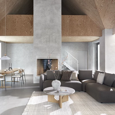 Modernt vardagsrum med kamin och stor mörk soffa