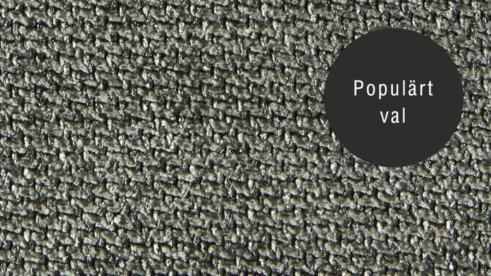 Närbild på tygprov av Austin-tyg i nyansen winter moss