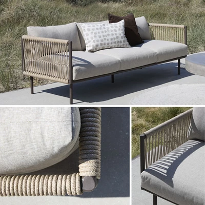 Havemöbler med grå dynor i olefin och sits och rygg i flätat design