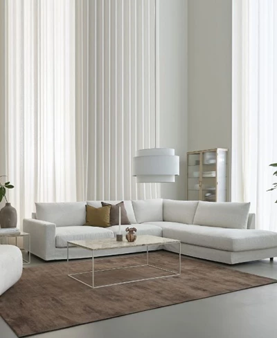 Ljus hörnsoffa i ett ljust vardagsrum.