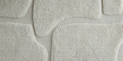 Marvion.jpg Närbild av vit matta med mönster