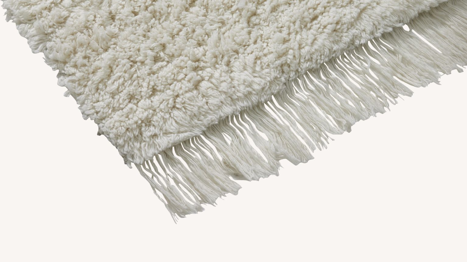 Närbild av ryamatta i vitt