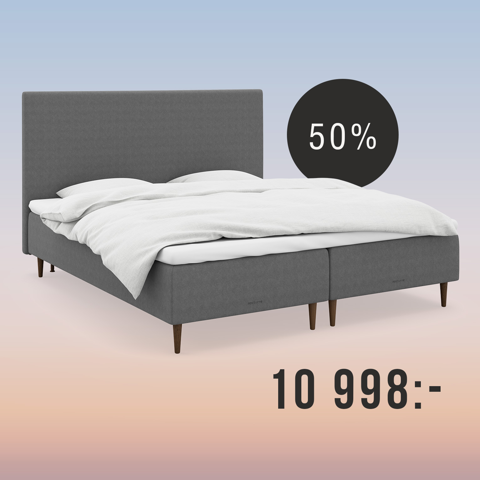 Grå säng med gavlar på regnbågsfärgad bakgrund