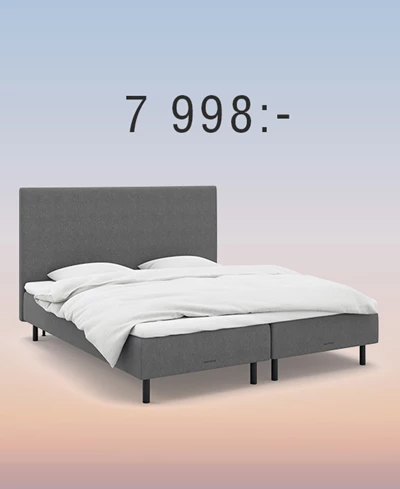 Grå resårbotten med gavel mot regnbågsfärgad bakgrund