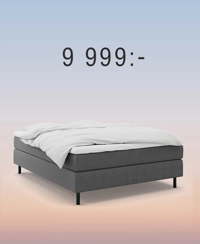 Grå kontinentalsäng mot regnbågsfärgad bakgrund