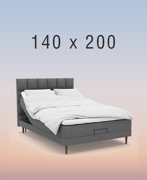 Grå ställbar säng på regnbågsfärgad bakgrund