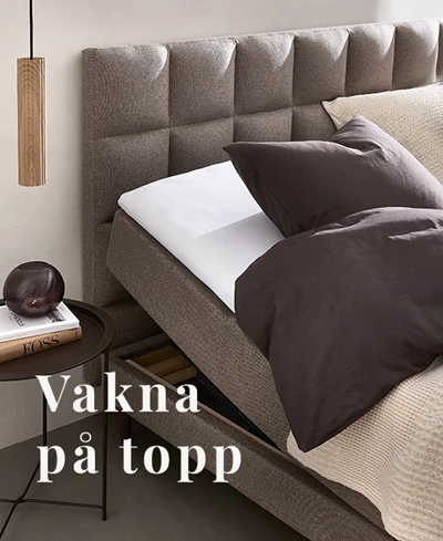 Grå ställbar säng med höjd madrass