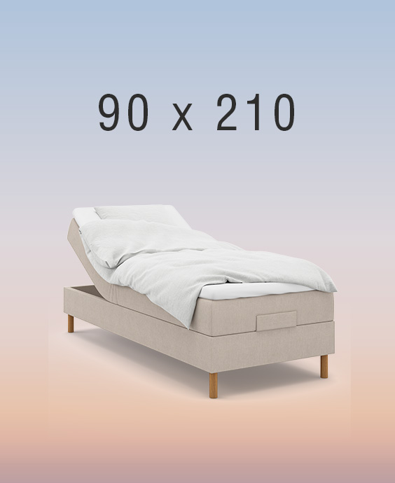 Ljusgrå ställbar säng på regnbågsfärgad bakgrund