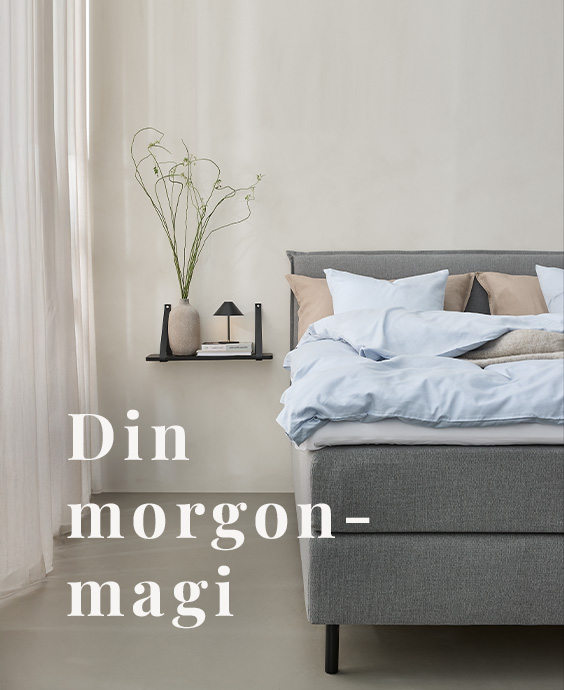 Grå kontinentalsäng i ett mysigt sovrum