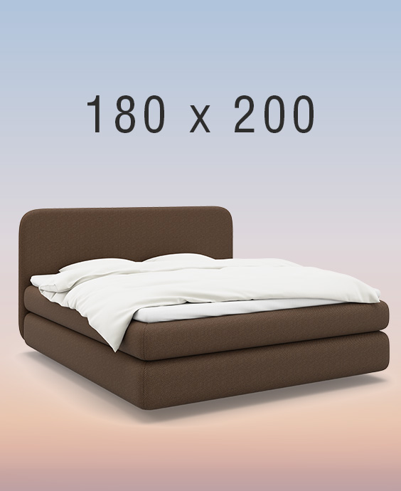 Grå kontinentalsäng på regnbågsfärgad bakgrund