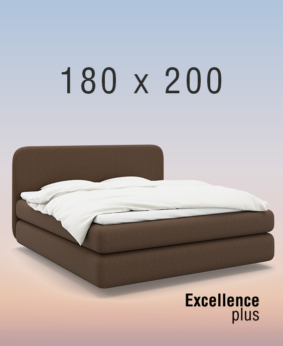 Grå kontinentalsäng på regnbågsfärgad bakgrund