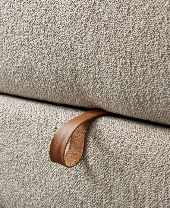 Närbild av tyg på bäddsoffa