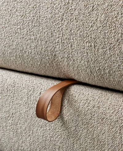 Närbild av tyg på bäddsoffa