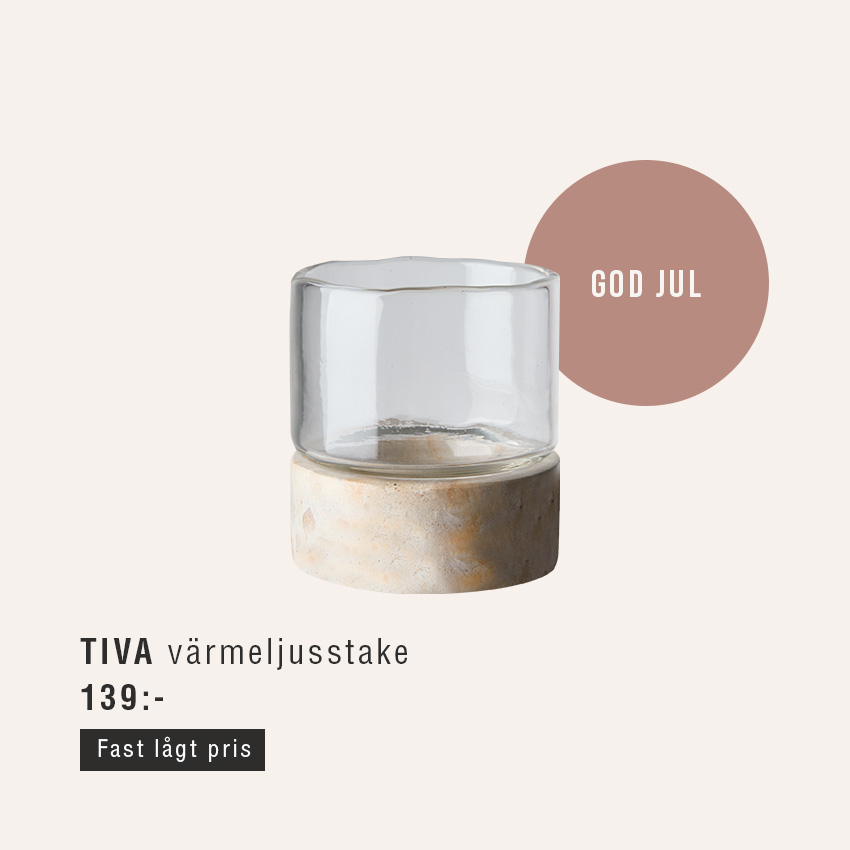 Ljusstake i glas med marmorfot.