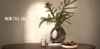 Miljö med julinspiration som rymmer kommunikationen Hem till jul