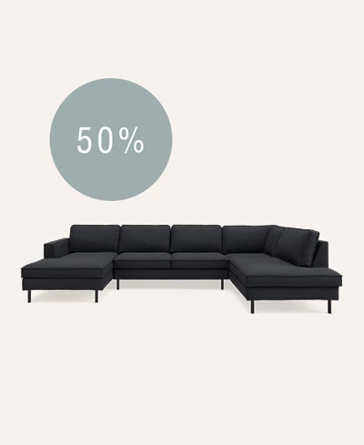 Chaiselongsofa i mørkeblå på beige baggrund