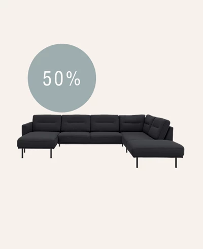 Mørkeblå u-sofa sofa på beige baggrund