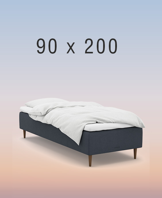 Ljusgrå ställbar säng på regnbågsfärgad bakgrund