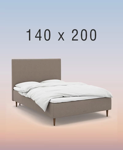 Ljusgrå ställbar säng på regnbågsfärgad bakgrund