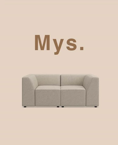 Grå modulsoffa mot beige bakgrund.