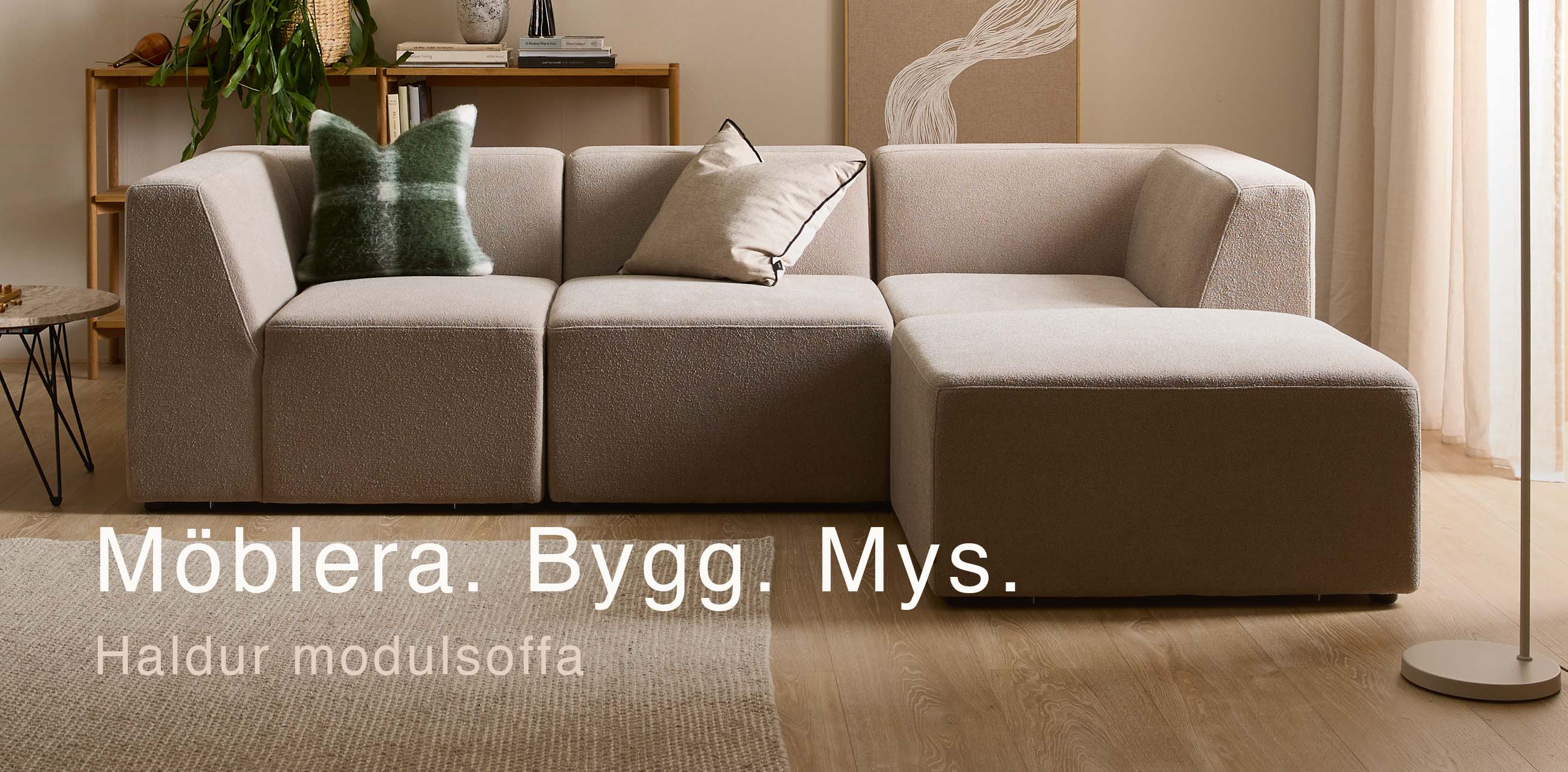 Grå modulsoffa med schäslong.
