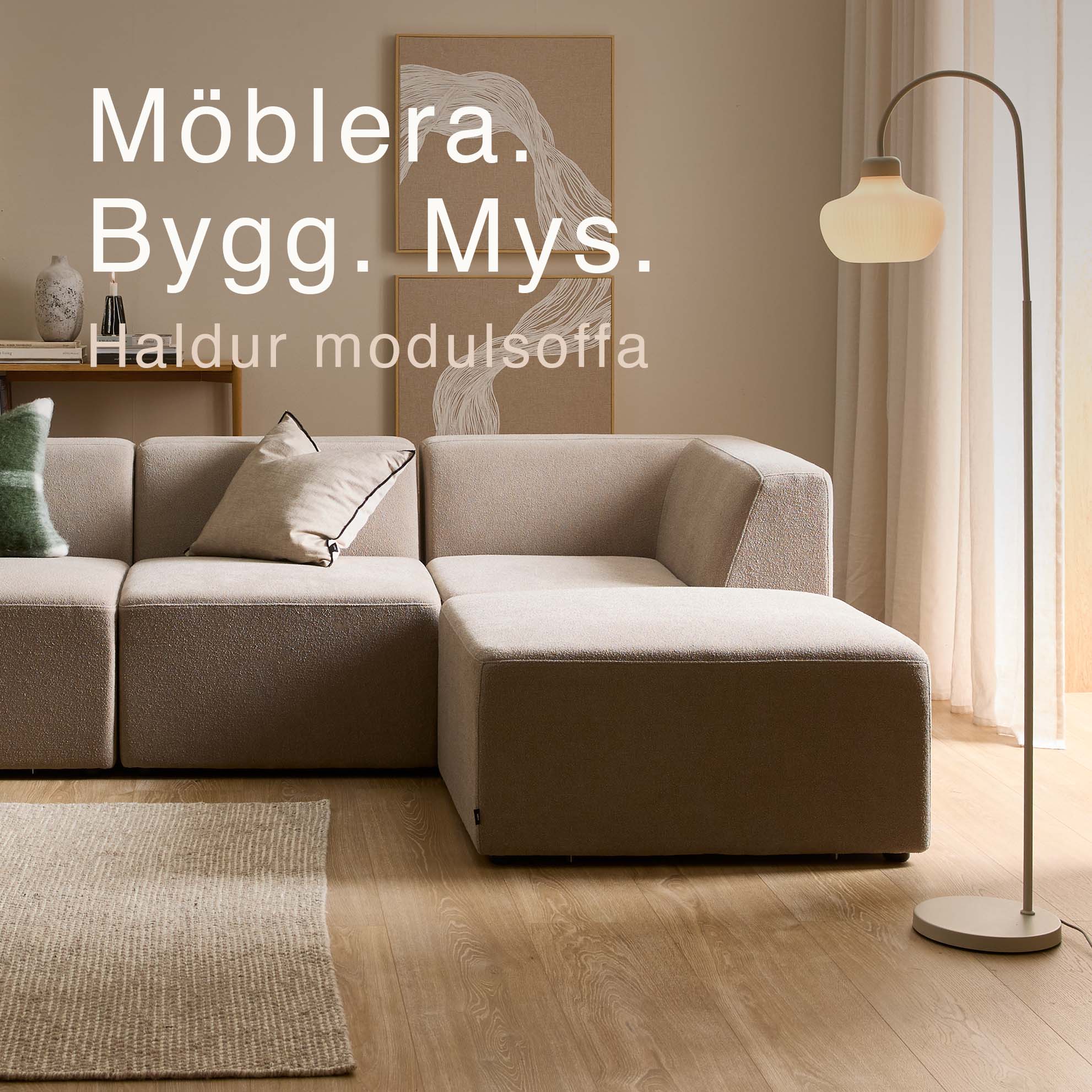 Grå modulsoffa med schäslong.