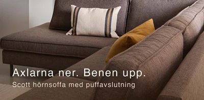Gråaktig soffa med tydliga sömmar.