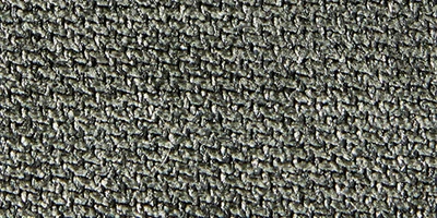 Närbild av textilen Winter Moss – Austin 13 med en dämpad grön nyans och melerad, vävd struktur.